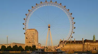 London Eye embankment view blue sky