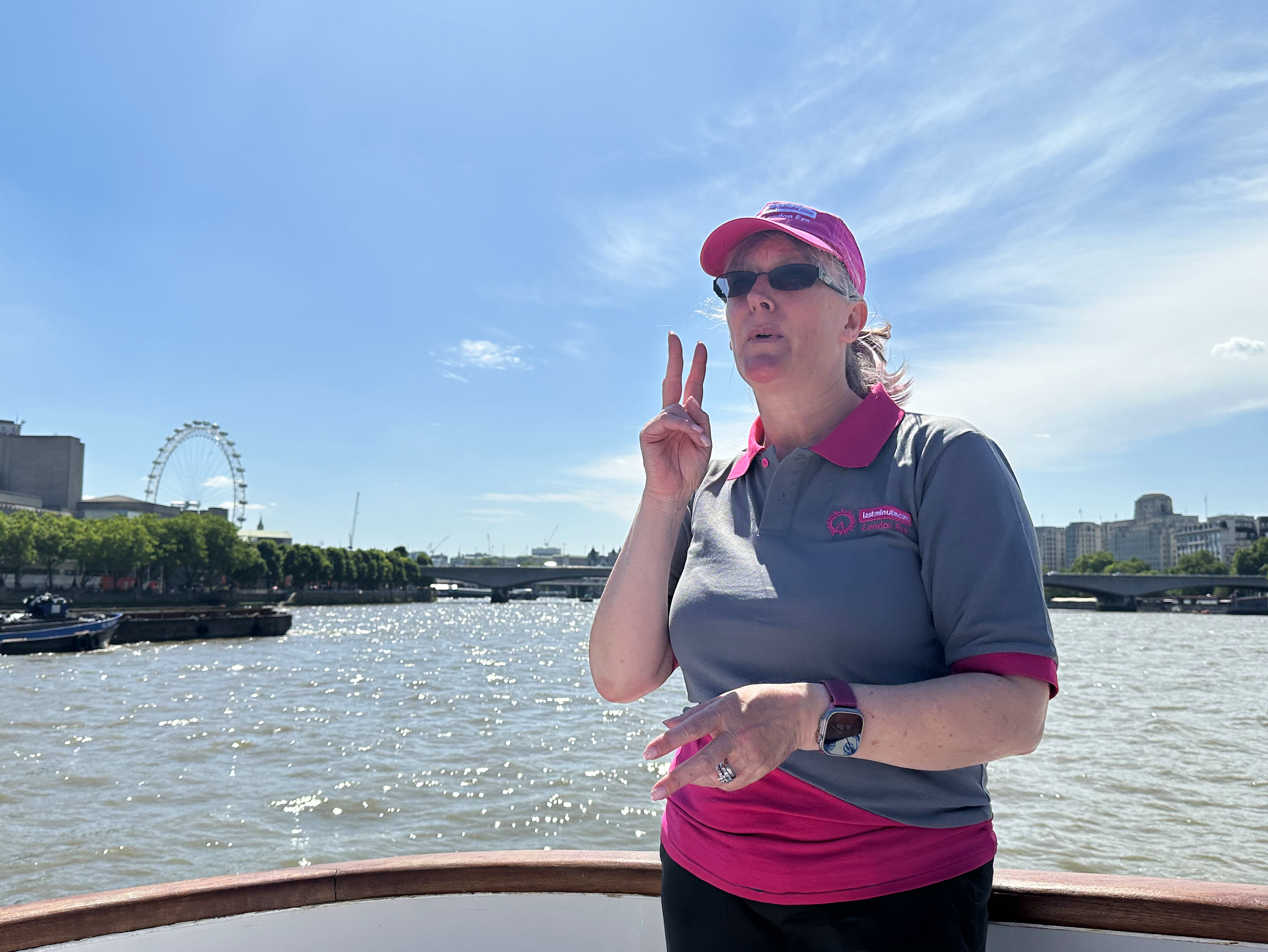 Person speaking signing language on the river thames 